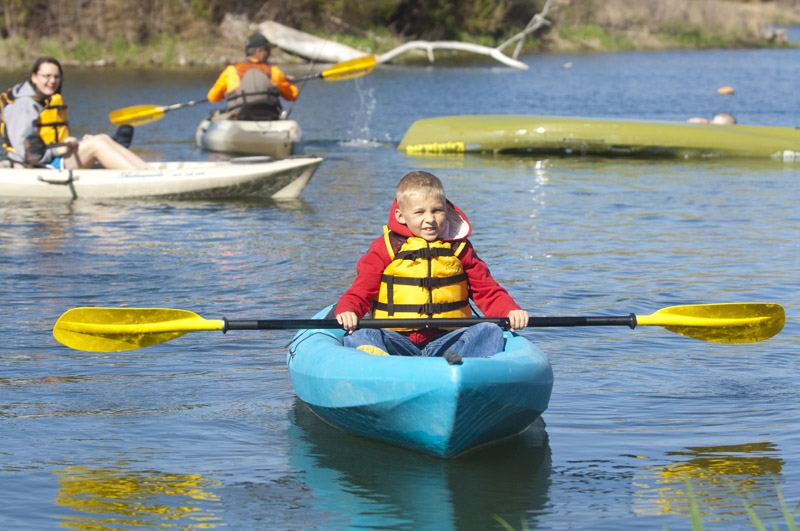 Young boy in a blue kayak at Fort Kearny State Recreation Area