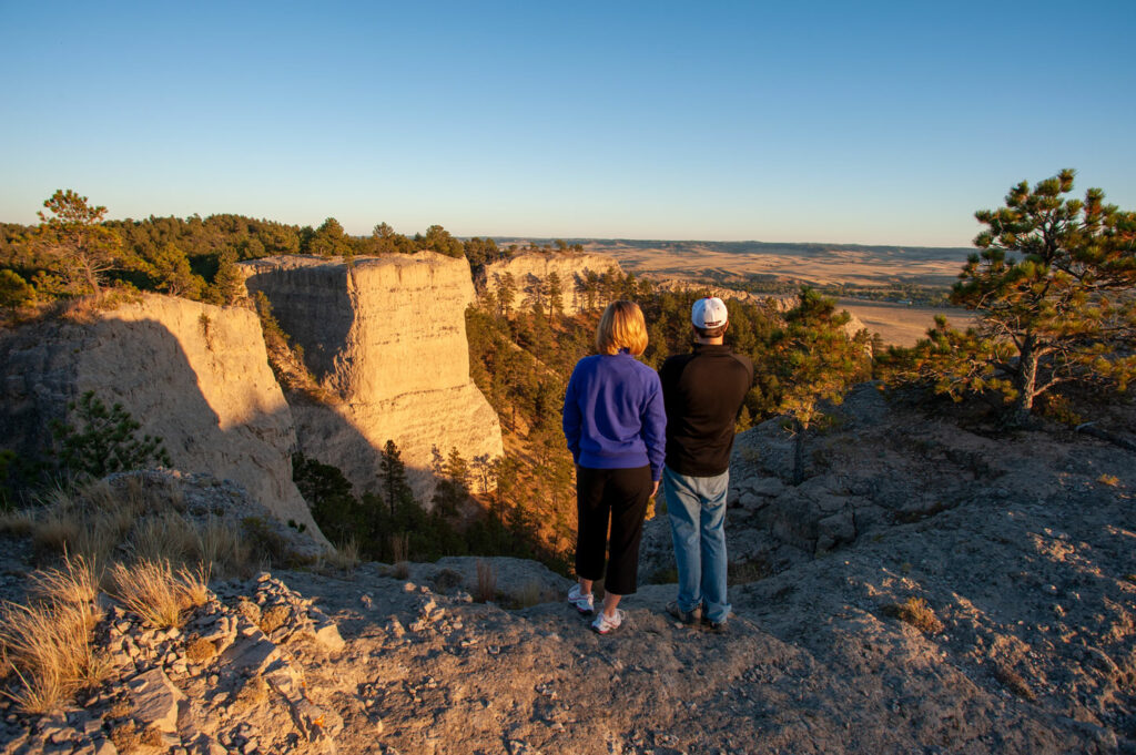 Two hikers look out over the buttes