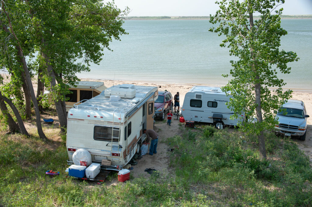 RV campers parked by the beach. 