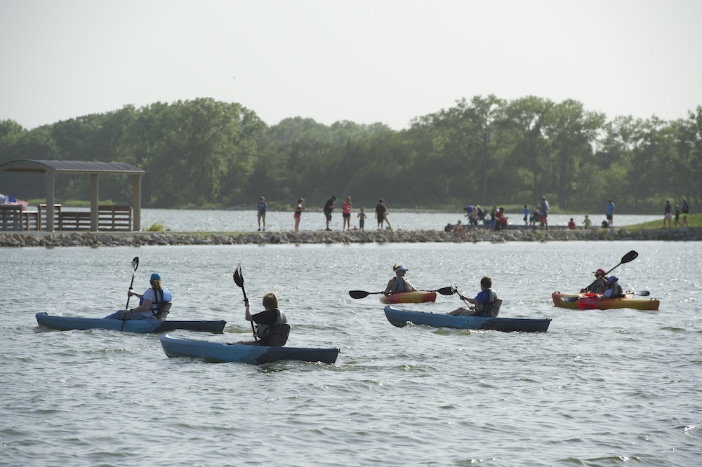 People kayak during "A Day at the Lake" at Conestoga