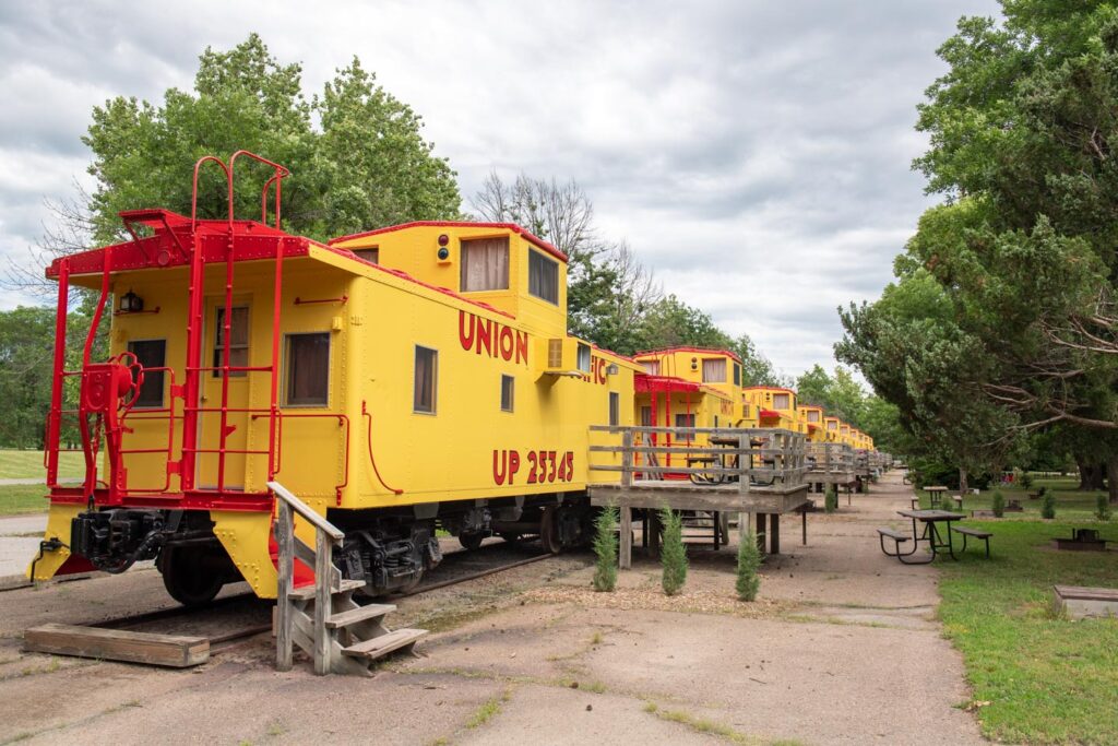 At Two Rivers State Recreation Area, visitors may stay overnight in yellow and red train cabooses for a unique lodging experience.