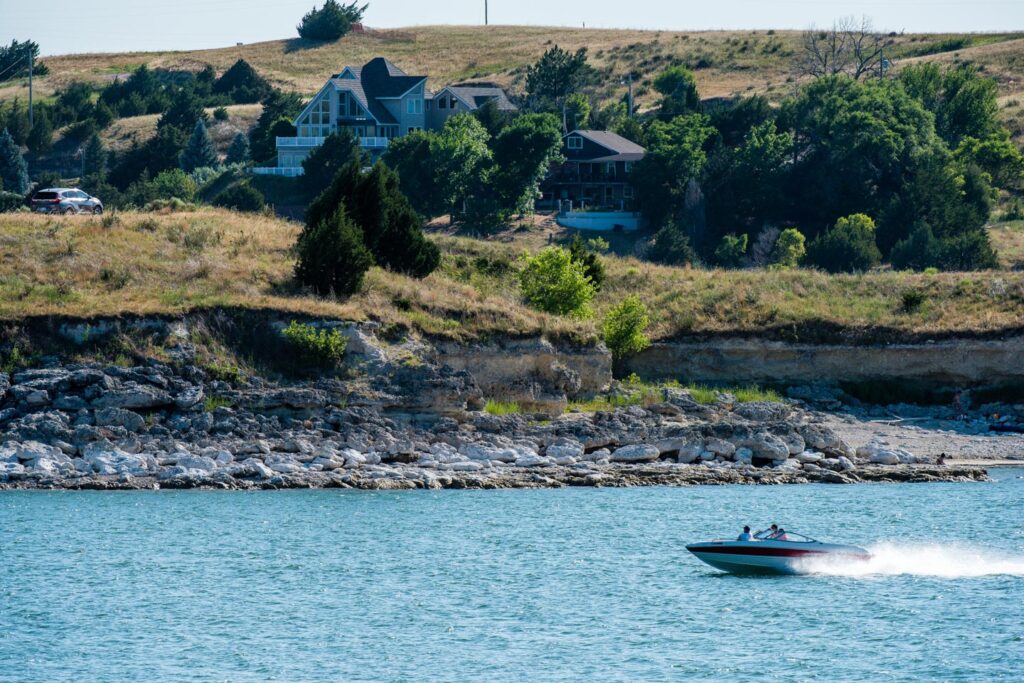 A speedboat cruises across a lake.