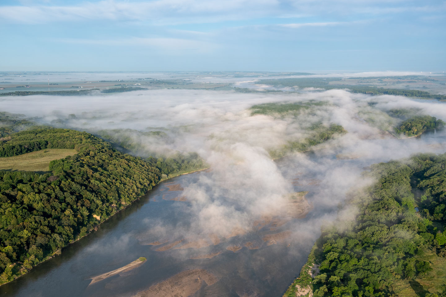 An aerial view shows fog above the Platte River.