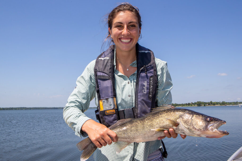 A woman holds a large walleye fish caught at Branched Oak Lake.