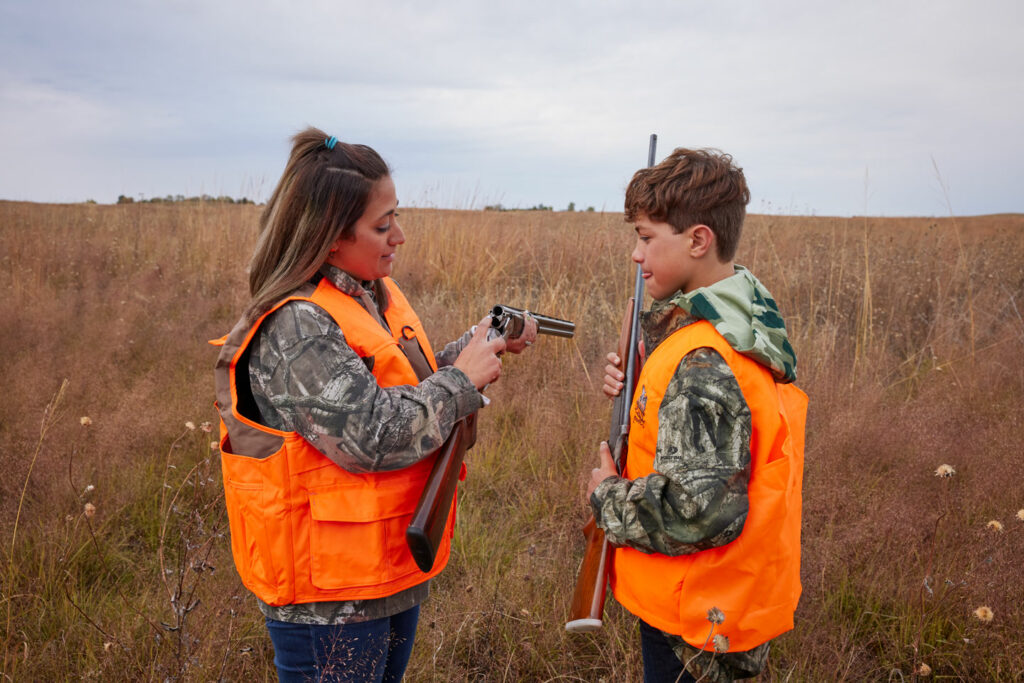 Mom teaching son about firearm