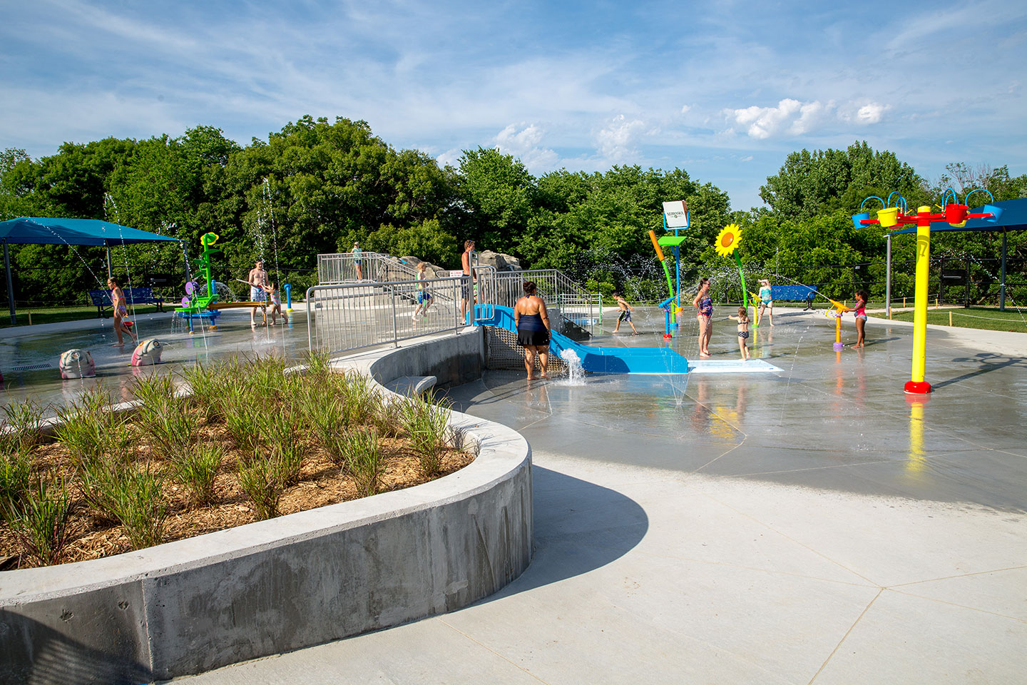 Visitors play in the spray park at Platte River State Park