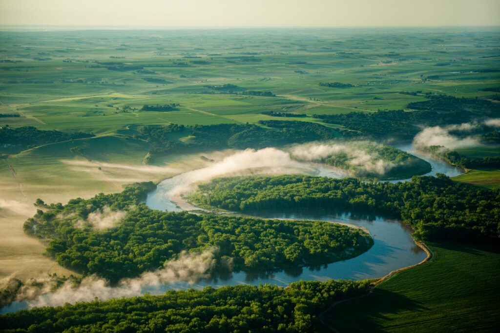 A river cuts through a wooded area