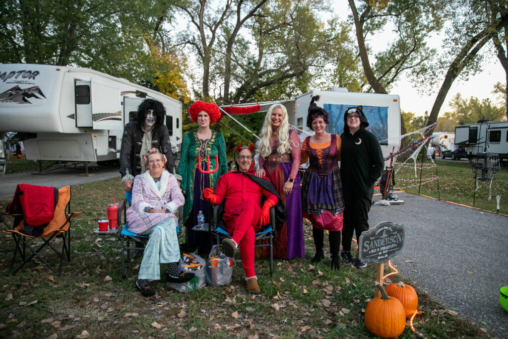 People dressed in Hocus Pocus costumes on their campsite at Fremont Lakes SRA during a Halloween event.