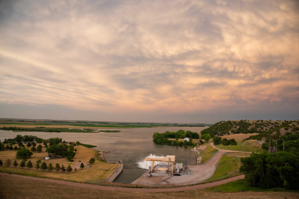 The setting sun colors the clouds above Lake Ogallala SRA.