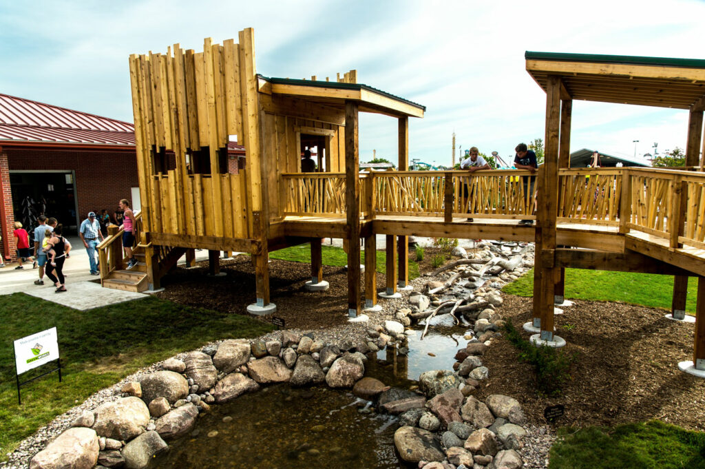 Families visit the Sky Fort natural playground at the Nebraska State Fair.