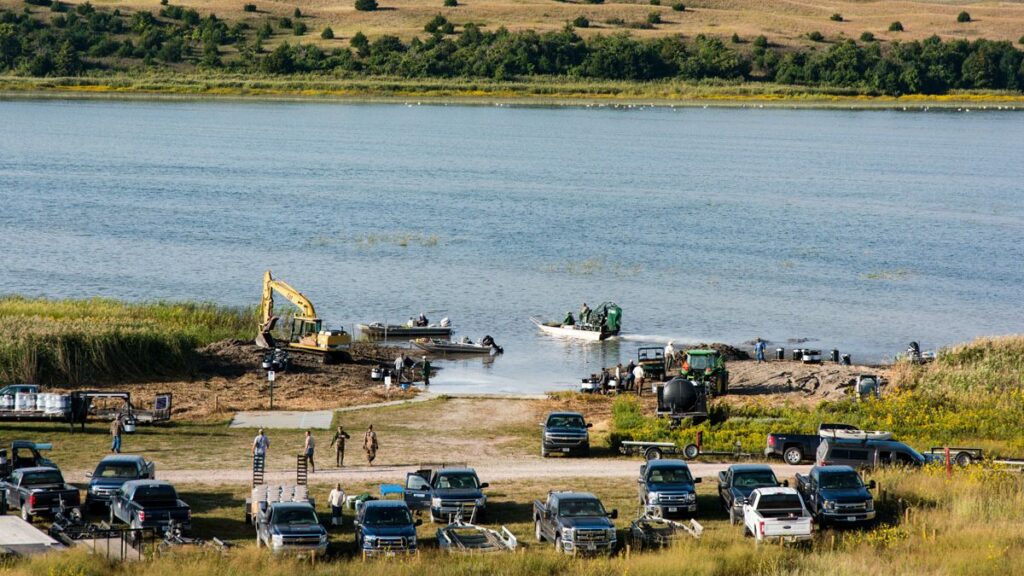 Trucks and boats by Pelican Lake.