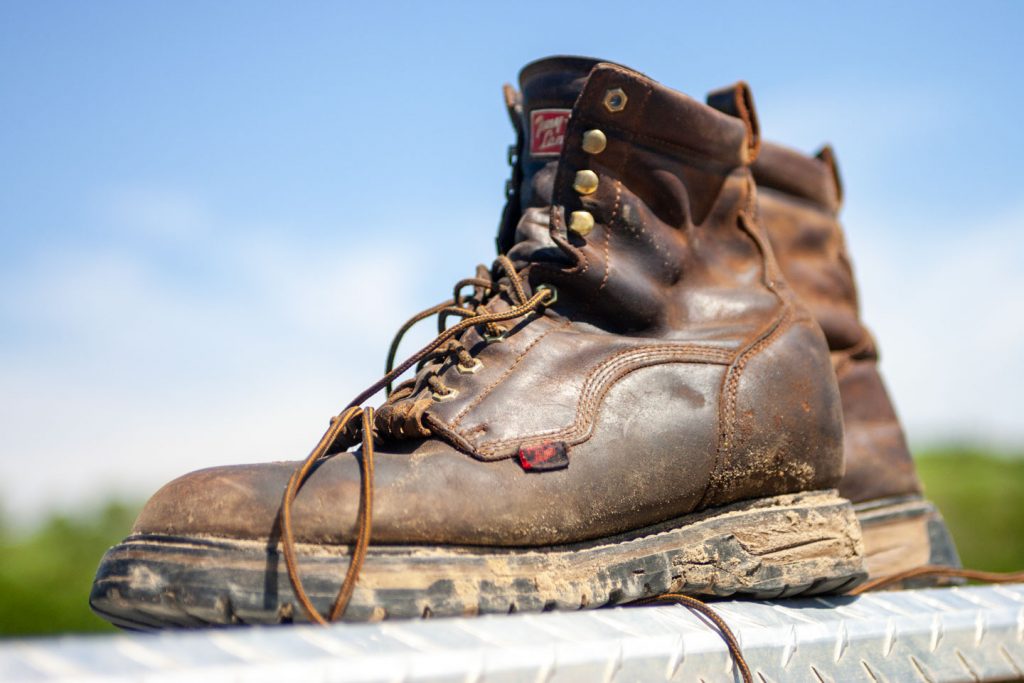 Close-up of a pair of brown leather hiking boots.