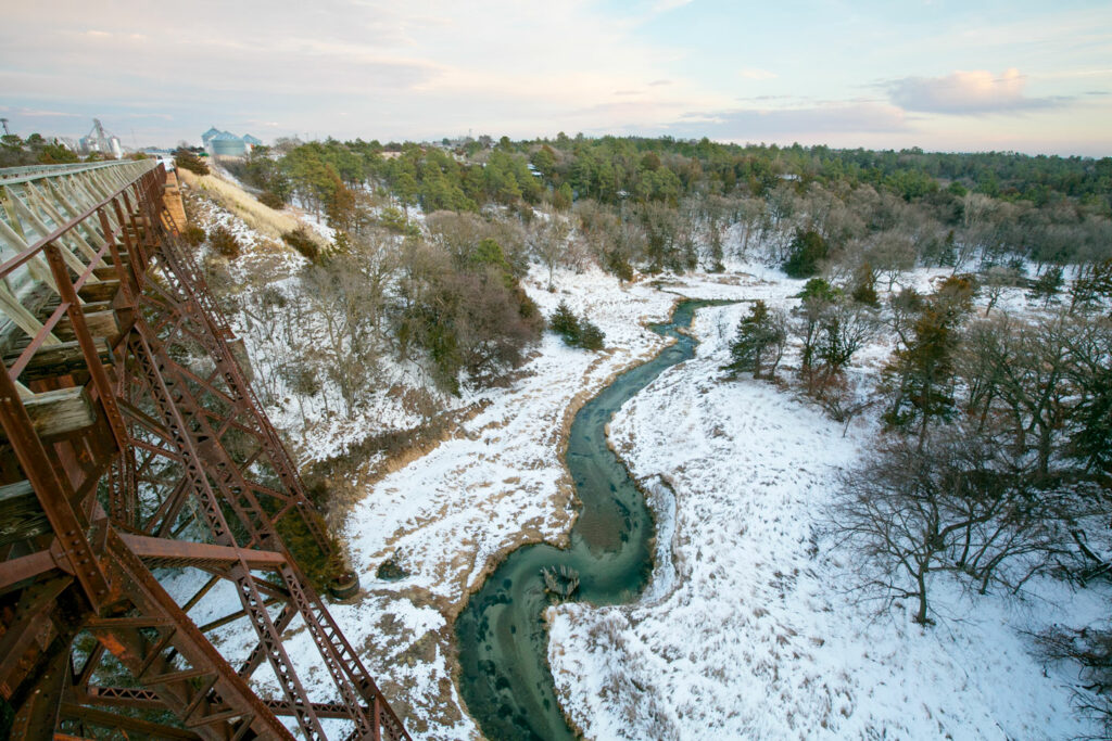 Bird's eye view of Long Pine Creek from the Cowboy Trail bridge in the winter.
