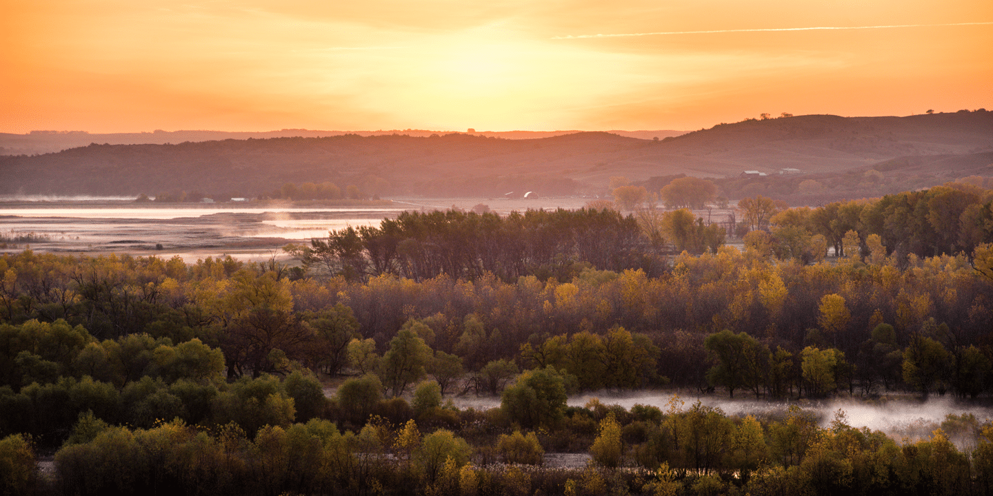 The sun rises over the confluence of the Niobrara and Missouri Rivers.
