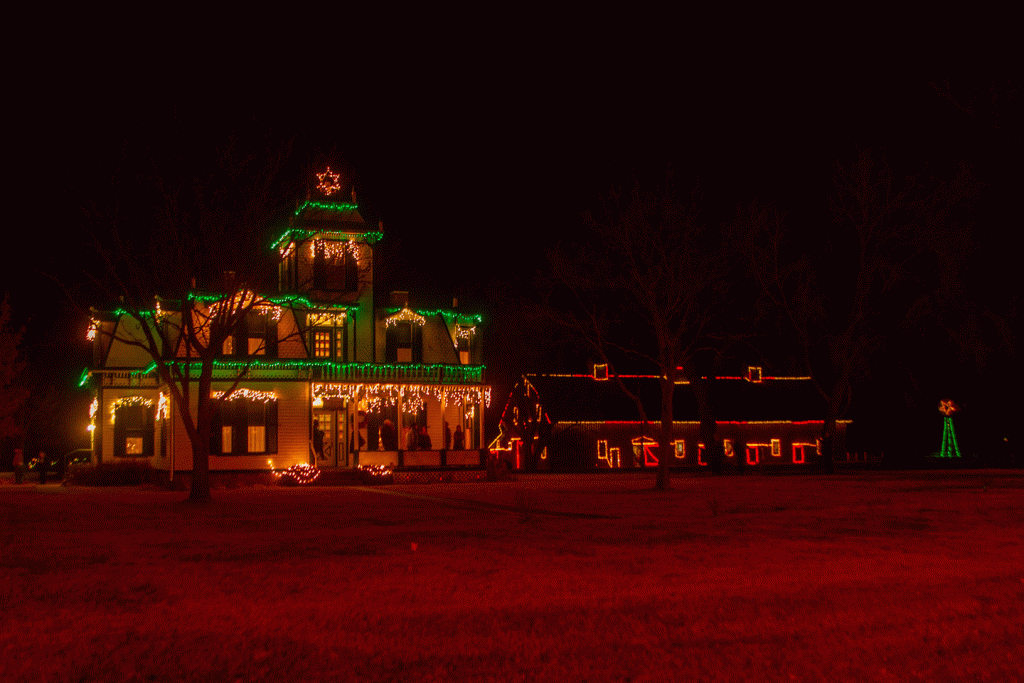 a victorian house covered in christmas lights