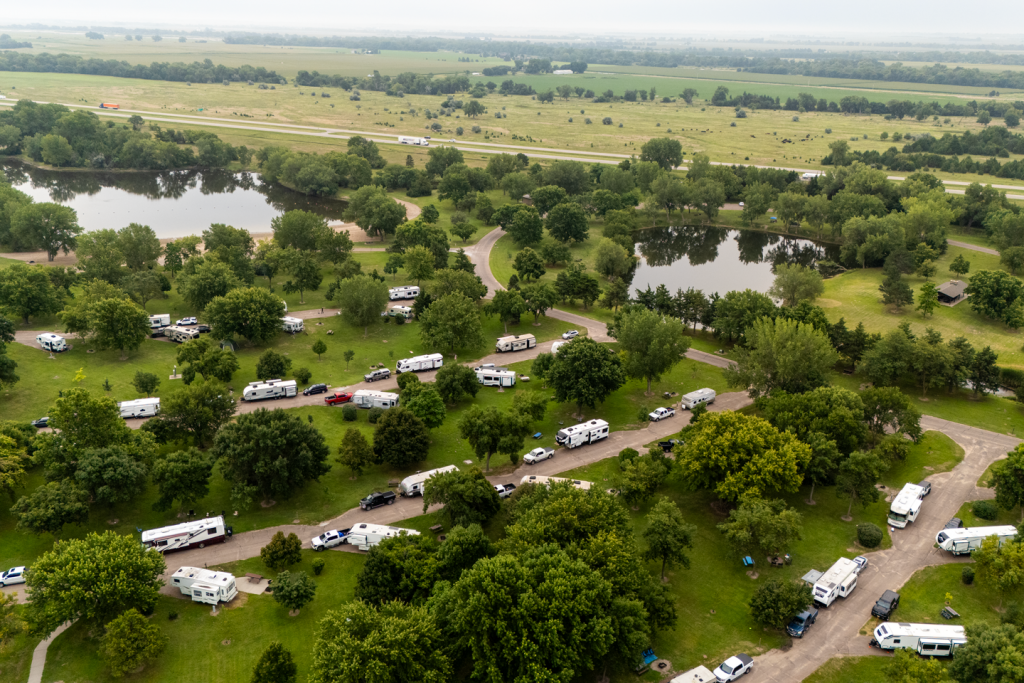 Aerial view of a busy park campground during summertime.