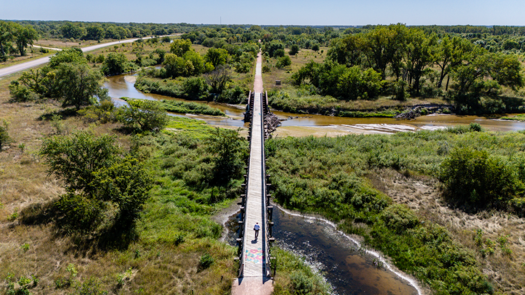 a aerial view of a narrow wooden bridge 